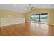 Living room with lake views and access to a balcony at 3038 Spirit Lake Dr, Winter Haven, FL 33880
