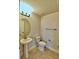 Clean and simple bathroom with pedestal sink at 1480 Leamington Lane, Winter Haven, FL 33884