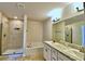 Spa-like bathroom with double vanity, soaking tub, and walk-in shower at 1480 Leamington Lane, Winter Haven, FL 33884