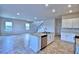 Open concept kitchen with island and breakfast bar at 1480 Leamington Lane, Winter Haven, FL 33884
