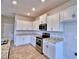 Modern kitchen with granite countertops and ample cabinet space at 1480 Leamington Lane, Winter Haven, FL 33884