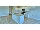 Modern kitchen with island and stainless steel appliances at 1480 Leamington Lane, Winter Haven, FL 33884