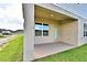 Covered back patio with access from the house at 1480 Leamington Lane, Winter Haven, FL 33884