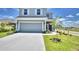 Two-story house with a gray exterior and attached garage at 1480 Leamington Lane, Winter Haven, FL 33884