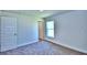 Spacious bedroom with carpet and neutral walls at 1560 Leamington Lane, Winter Haven, FL 33884