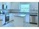 Bright kitchen with stainless steel appliances at 1560 Leamington Lane, Winter Haven, FL 33884
