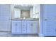 Elegant bathroom with double sinks and granite countertops at 1560 Leamington Lane, Winter Haven, FL 33884