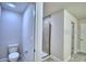 Modern bathroom with a shower and toilet at 1560 Leamington Lane, Winter Haven, FL 33884