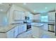 Spacious kitchen with an island and granite countertops at 1560 Leamington Lane, Winter Haven, FL 33884