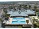 Resort-style community pool, tennis courts, and clubhouse with lake access at 4104 Martindale Loop, Winter Haven, FL 33884