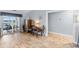 Light-filled living area featuring hardwood floors and sliding glass doors leading to a patio at 1437 Grand Cayman Cir, Winter Haven, FL 33884