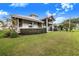 Home exterior with covered porch and well-maintained lawn at 29 Turtle Ln, Haines City, FL 33844