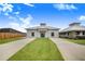 House exterior with double driveway and manicured lawn at 29 Turtle Ln, Haines City, FL 33844