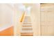 Carpeted staircase with wooden handrail at 29 Turtle Ln, Haines City, FL 33844
