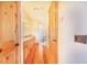 Bathroom with double vanity, granite countertop, and wood floors at 29 Turtle Ln, Haines City, FL 33844