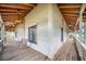 Spacious covered porch with wooden flooring and comfortable seating at 29 Turtle Ln, Haines City, FL 33844