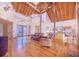 Open living room with high ceilings, hardwood floors, and kitchen view at 29 Turtle Ln, Haines City, FL 33844