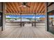 Deck overlooking waterfront with scenic view and ceiling fan at 29 Turtle Ln, Haines City, FL 33844