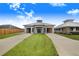 House exterior with double driveway and manicured lawn at 29 Turtle Ln, Haines City, FL 33844