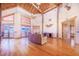 Open living room with hardwood floors and exposed beams at 29 Turtle Ln, Haines City, FL 33844