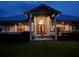 Night view of a charming two-story home with a porch at 29 Turtle Ln, Haines City, FL 33844