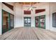 Spacious deck with multiple access points and green doors at 29 Turtle Ln, Haines City, FL 33844