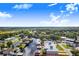 Aerial view of waterfront home with private dock and expansive backyard at 29 Turtle Ln, Haines City, FL 33844