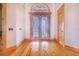 Elegant entryway with double doors and hardwood floors at 29 Turtle Ln, Haines City, FL 33844