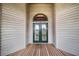 Double front doors with beveled glass and wood frame at 29 Turtle Ln, Haines City, FL 33844