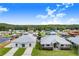 Aerial view of two waterfront homes with expansive docks and beautiful landscaping at 29 Turtle Ln, Haines City, FL 33844