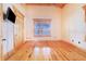 Bedroom with wood floors and plantation shutters at 29 Turtle Ln, Haines City, FL 33844