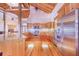 Modern kitchen with stainless steel appliances and hardwood floors at 29 Turtle Ln, Haines City, FL 33844