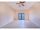 Spacious bedroom with tile floors and French doors at 29 Turtle Ln, Haines City, FL 33844