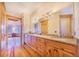 Elegant bathroom with double vanity, large mirror, and wood cabinetry at 29 Turtle Ln, Haines City, FL 33844