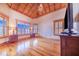 Spacious bedroom with wood floors, wood ceiling, and large windows at 29 Turtle Ln, Haines City, FL 33844
