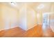 Light and airy hallway with wood flooring at 29 Turtle Ln, Haines City, FL 33844