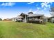 Charming home with metal roof, landscaping, and spacious yard at 29 Turtle Ln, Haines City, FL 33844