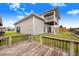 Home exterior with a second story balcony and green door at 29 Turtle Ln, Haines City, FL 33844