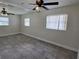 Bright bedroom with ceiling fan, tile flooring and neutral walls at 508 N Oak Ave, Fort Meade, FL 33841