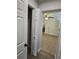 Home hallway with vinyl flooring, closet, and doors to bedrooms and bath at 508 N Oak Ave, Fort Meade, FL 33841