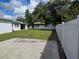 Large backyard with green lawn and a white fence at 508 N Oak Ave, Fort Meade, FL 33841