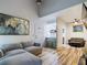 Open living room featuring a sectional sofa and wood-look flooring at 2049 San Marcos Se Dr # 127, Winter Haven, FL 33880