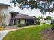 Exterior view of the building with stairs and landscaping at 2049 San Marcos Se Dr # 127, Winter Haven, FL 33880