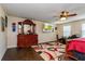 Main bedroom with a large dresser, king-size bed and hardwood floors at 3540 Julius Estates Blvd, Winter Haven, FL 33881