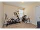 Bedroom with elliptical machine, sewing machine and desk at 3540 Julius Estates Blvd, Winter Haven, FL 33881