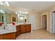 Bathroom features double sinks, granite countertops, and a large mirror at 3540 Julius Estates Blvd, Winter Haven, FL 33881