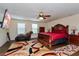 Large main bedroom with a king-size bed, ceiling fan, and hardwood floors at 3540 Julius Estates Blvd, Winter Haven, FL 33881