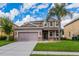 Two-story house with a landscaped lawn and attached garage at 3540 Julius Estates Blvd, Winter Haven, FL 33881