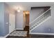 Bright entryway with staircase and wood-look tile floors at 3540 Julius Estates Blvd, Winter Haven, FL 33881