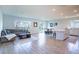 Open floor plan boasts spacious living area, kitchen, and dining area with tile flooring at 1011 Overlook Ct, Davenport, FL 33837